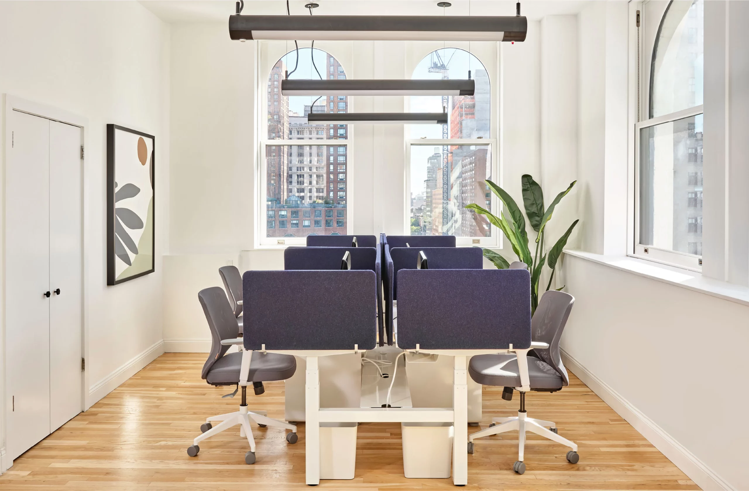 Open space cluster of desks for employee work stations