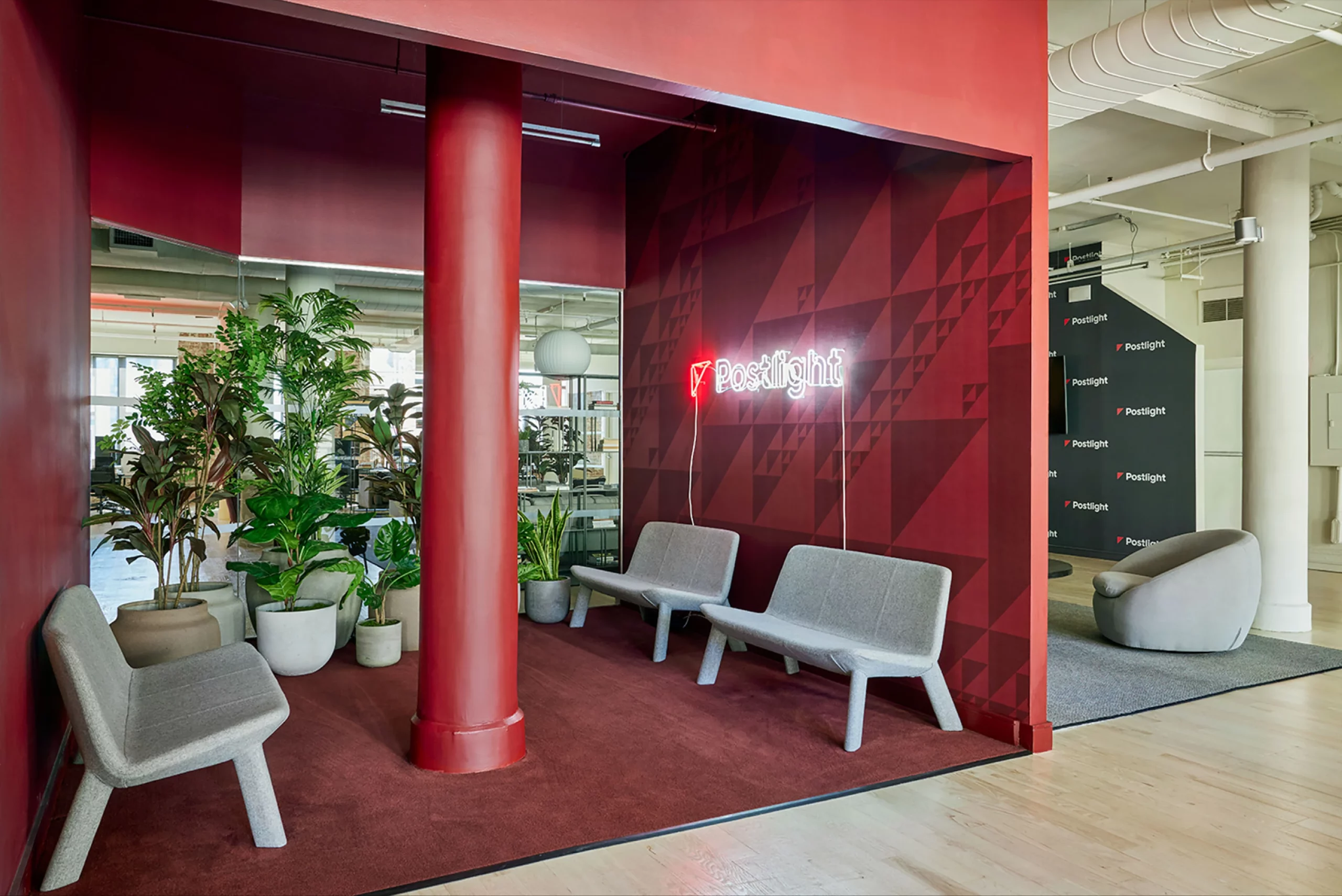 Cool Reception Design With Grey Seats and Red Walls